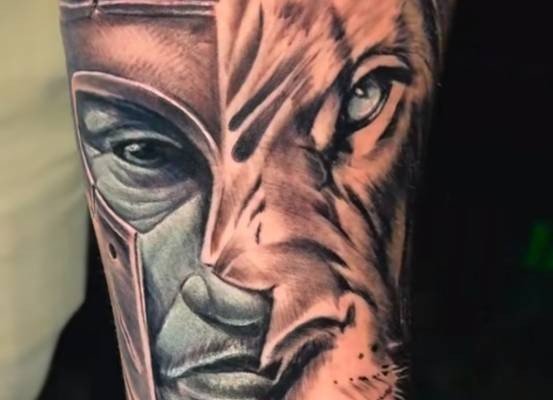 Lion head in a detailed tattoo composition