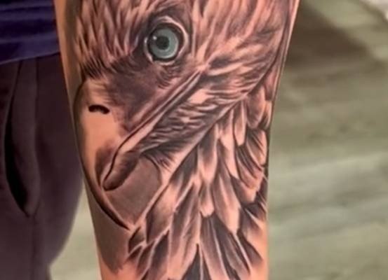 Eagle head tattoo on a forearm
