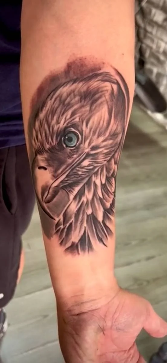Eagle head tattoo on a forearm