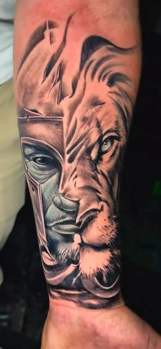 Lion head in a detailed tattoo composition